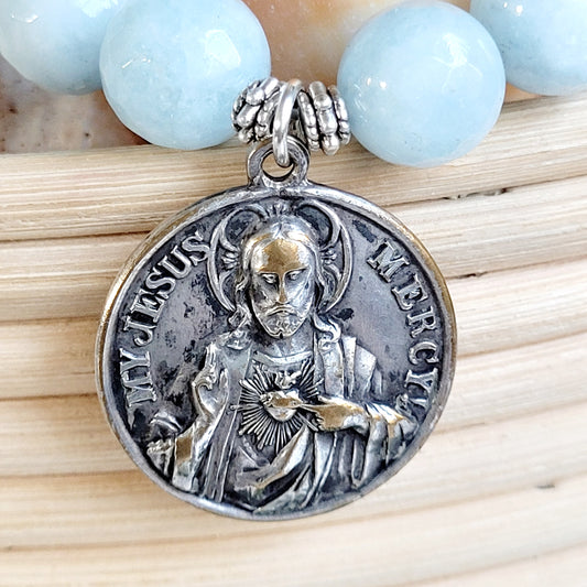 Aquamarine Faceted 12mm Beaded Bracelet w/ Large Deeply Embossed Medal of Jesus Mercy and Mary Pray for Us on the back