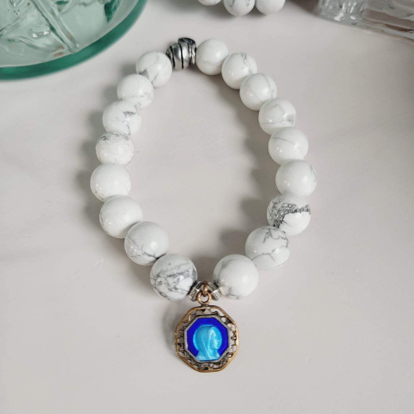 White Howlite 10mm Beaded Bracelet w/ Gold Plated Blue Enameled Medal of Our Lady of Lourdes