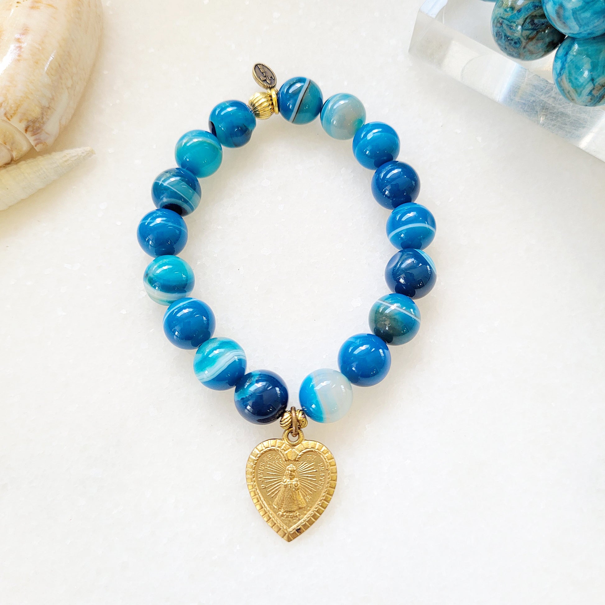 Blue Line Agate 10mm Beaded Bracelet w/ Gold Plated Medal of Infant of Prague / Sacred Heart of Jesus - Afterlife Jewelry Designs