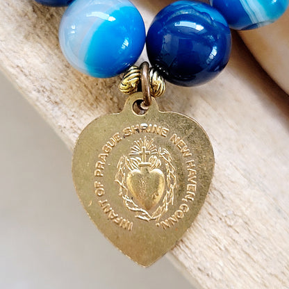 Blue Line Agate 10mm Beaded Bracelet w/ Gold Plated Medal of Infant of Prague / Sacred Heart of Jesus - Afterlife Jewelry Designs